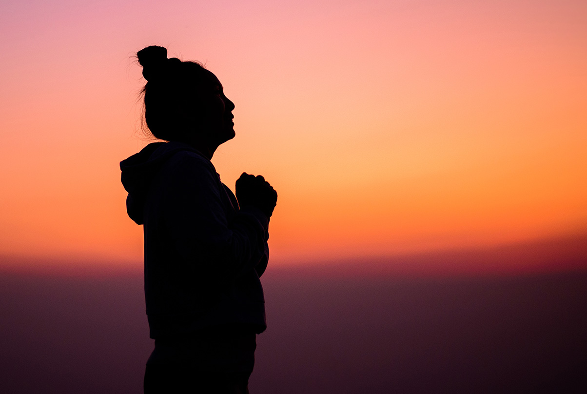 Girl with hands together